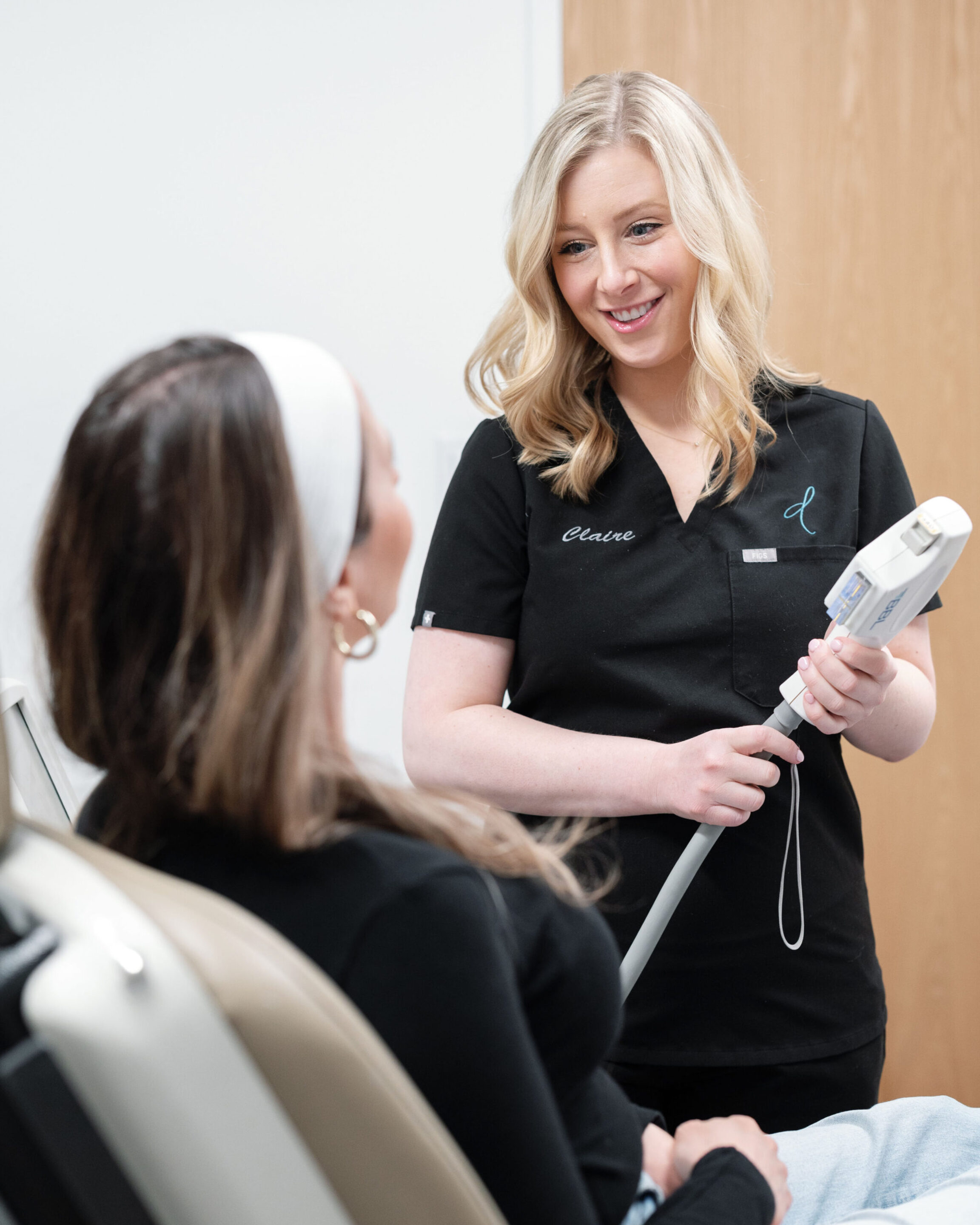 Claire Hinkle, PA-C, working with a patient in the office