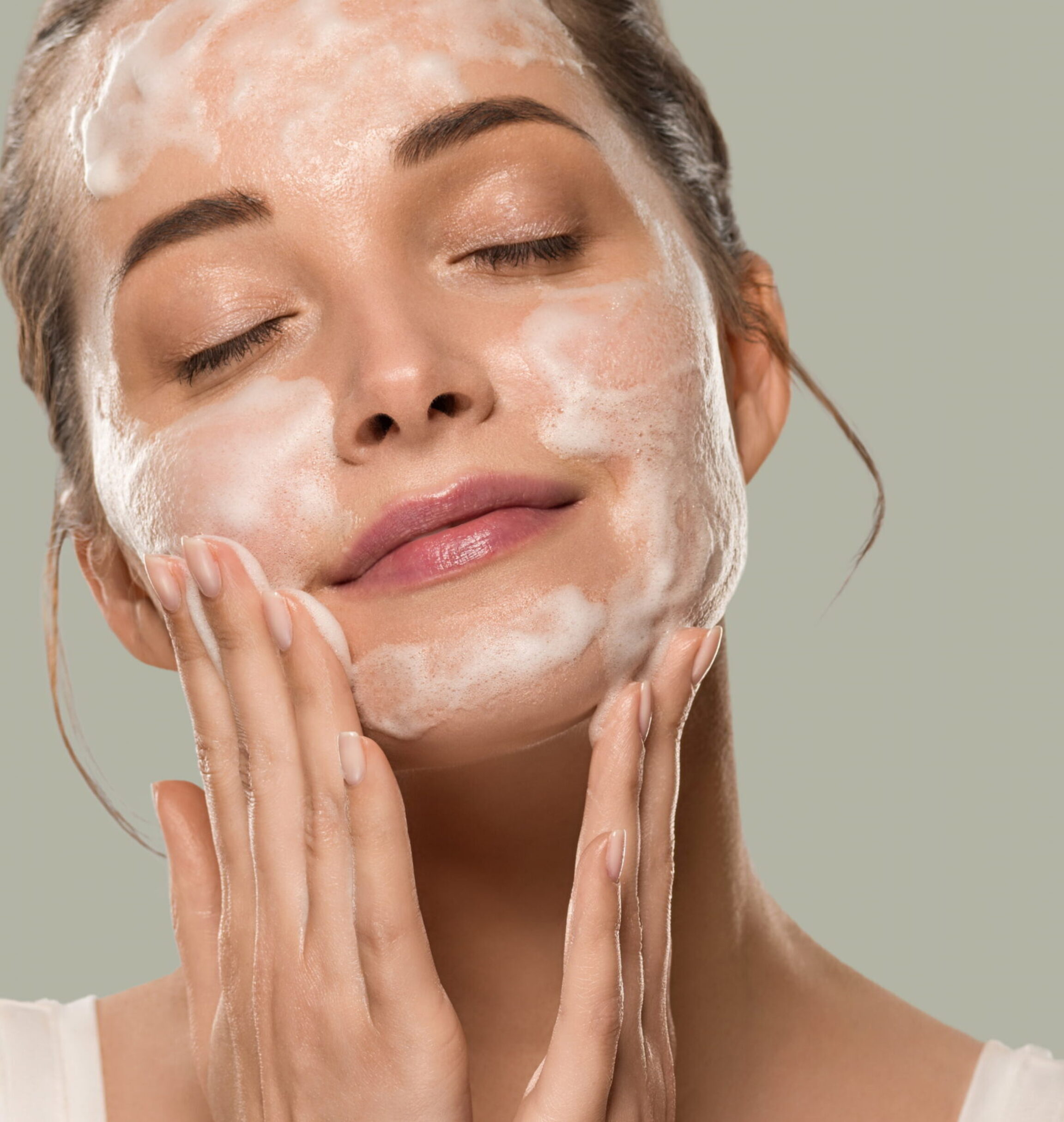 Woman applying medical grade skincare products to improve dull skin