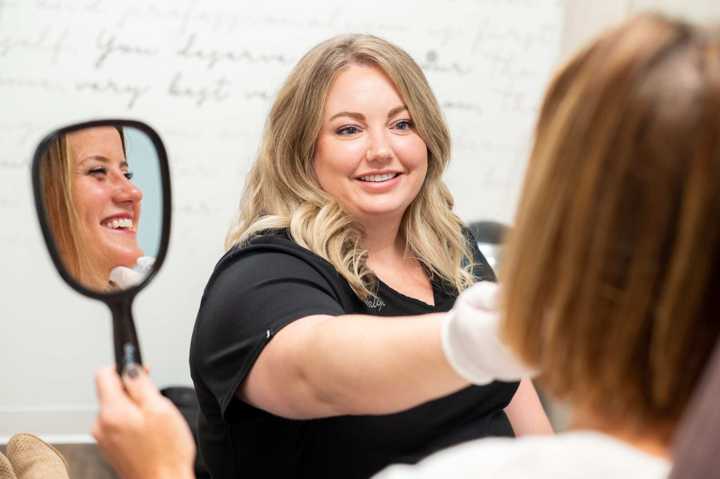 Paige performing a Rosacea skin consultation with a patient