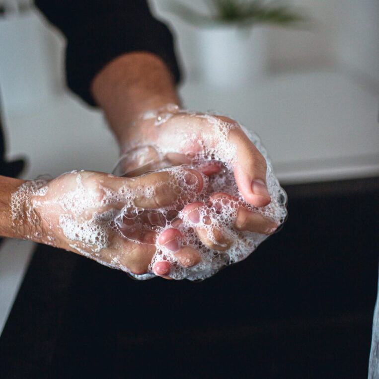 A patient washing their hands