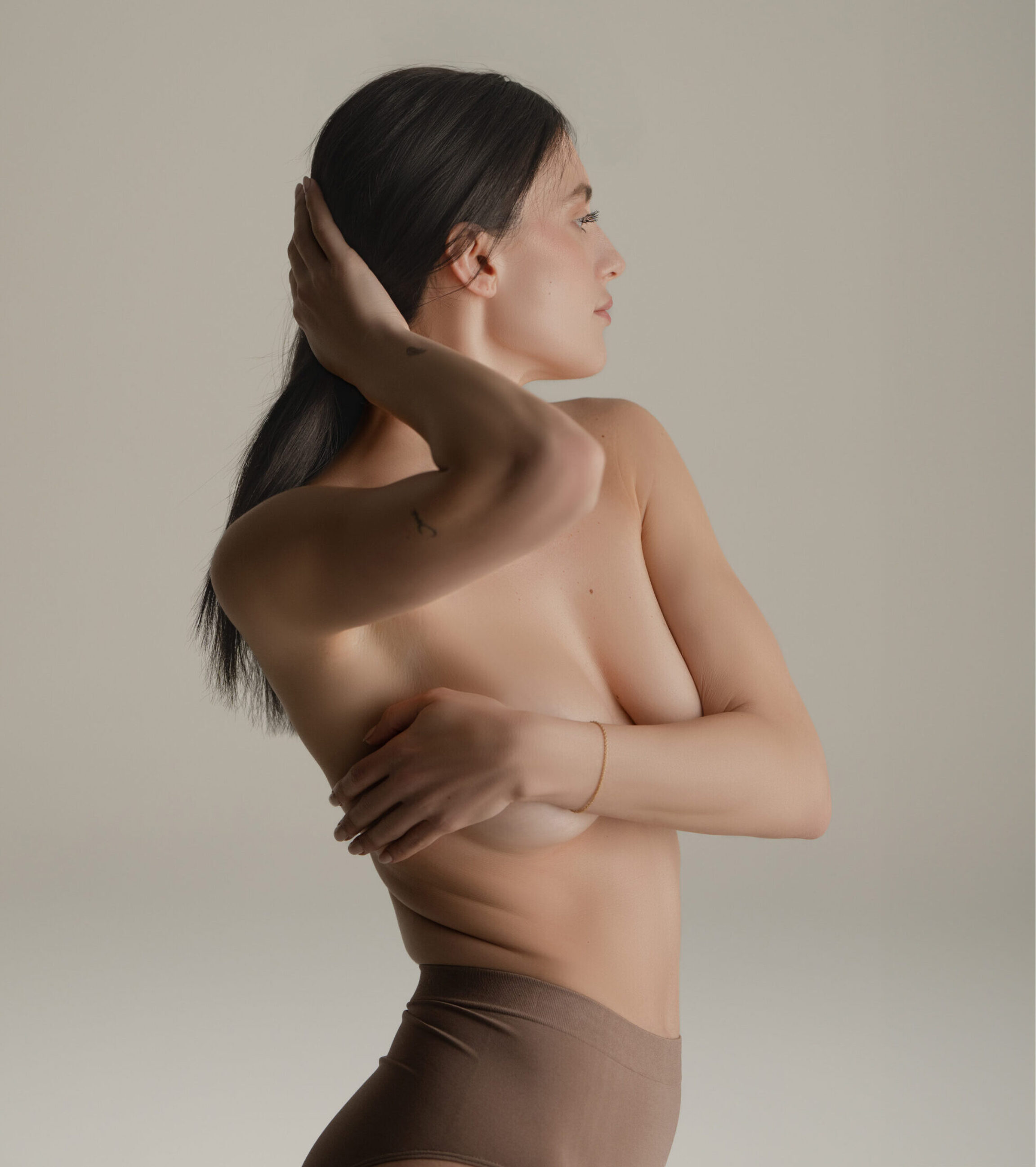 Breast augmentation patient in muted lighting